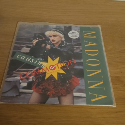 Madonna causing a - causing, commotion